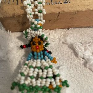 American Indian made beaded doll necklace